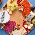 Hosting Tips: How to Combine a Cheese Wheel with a Meat Platter